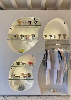 the shelves are filled with various items in different shapes and sizes, along with bowls on them