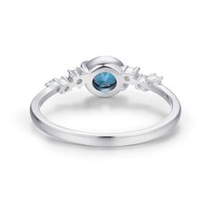 A celestial masterpiece that will leave you spellbound. Our Planet Ring features a london blue topaz center stone that captures the enchanting allure of Saturn, crafted with meticulous detail. Adding to the celestial allure, delicate accents of aquamarine and white gems gracefully orbit around the center stone, reminiscent of twinkling stars in the night sky. Embrace the magic of the universe and let your style soar to new heights. Let your own unique light shine brightly. ✦ Available in both 14 Celestial Blue Topaz Ring For Gift, Blue Celestial Ring With Center Stone, Celestial Blue Topaz Ring Gift, Celestial Blue Rings With Accent Stones, Blue Celestial Rings With Accent Stones, Blue Topaz Diamond Ring With Gemstone Accents, Celestial Style Sapphire Ring In White Gold, Celestial White Gold Sapphire Ring, Sapphire-colored Blue Topaz Birthstone Ring