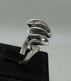 Stylish sterling silver ring 925/1000. Stamped 925. Approximate weight 7.6 grams. Top width 1.6cm. All our jewels are made from solid sterling silver 925/1000 and are carefully crafted by hand in our family workshop. We dispatch your orders in 5 working days, worldwide and the postage is $5. We ship registered priority mail. Please allow 5-7 working days for delivery in Europe and 10-15 working days outside Europe. For any questions - please do not hesitate to contact me! Sterling Silver Concave Ring Stamped 925, Sterling Silver Concave Hallmarked Rings, Sterling Silver Concave Rings Hallmarked, Unique Formal Sterling Silver Rings, Unique Sterling Silver Rings For Formal Occasions, Sterling Silver Open Ring For Collectors, Formal Sterling Silver Rings With Unique Design, Sterling Silver Rings With Unique Design For Formal Events, Sterling Silver Rings With Unique Design For Formal Occasions