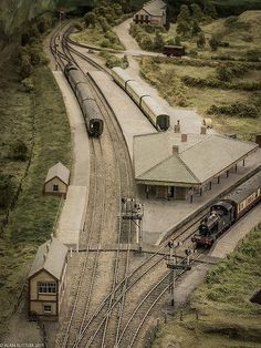 an aerial view of a model train station