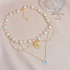 Elevate your spring fashion with our enchanting Beaded Necklace featuring a dazzling gold-plated zircon Daisy Pendant. Crafted with exquisite glass beads, faux pearl beads, and a delicate crystal butterfly bead, this necklace embodies the essence of princesscore aesthetic, adding a touch of whimsical charm to any ensemble. 🌷 Perfect for Spring Vibes: Capture the beauty of springtime with this elegant necklace, designed to complement your spring wardrobe effortlessly.  Whether you're attending a Princesscore Aesthetic, Prom Necklaces, Daisy Pendant, Daisy Charm, Crystal Butterfly, Sparkle Jewelry, Elegant Necklace, Spring Vibes, Elegant Necklaces