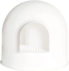 a white plastic object with a hole in the middle and an opening on the side