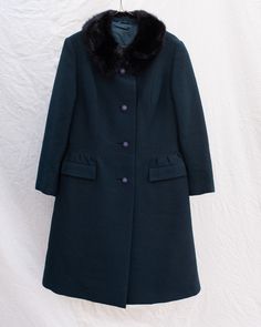 [in the mood to move furniture and dance]Fun fact about this coat: Did you know that this vintage 1950's swing coat is just as easy to wear now than it was 70 years ago? The flattering shape, the trendy color, the warm wool-it brings us back to a time of chivalresque charm without giving up on modern conveniences. This one is for women who are looking for something cute but practical. Let this be your winter wardrobe workhorse—wear with everything from boots or sneakers to dresses or jumpsuits!• Fitted Long Wool Coat In Vintage Style, Fitted Vintage Long Wool Coat, Fitted Vintage Wool Coat, Vintage Fitted Long Wool Coat, Vintage Fitted Wool Coat For Winter, Retro Fitted Winter Outerwear, Fitted Winter Outerwear For Vintage Fashion, Fitted Retro Long Coat, Retro Fitted Long Coat