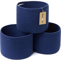 three blue round baskets stacked on top of each other with a price tag attached to them