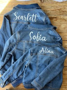 Custom made denim jackets for your kiddos everyday wear! Add some unique style to your loved ones wardrobe with our personalized denim jacket.  Size of name may vary depending on how long or short their name is. Please keep in mind that I can only go as long or tall as the upper shoulder of the jacket is. For example The name 'Ava' will be a lot large vs a longer first/middle name like 'Anastasia White'. I don't have all the size listed, but if you don't see the size you want, I am able to get size 12 months all the way up to big girl size 14.  All names will be printed in white. Material is iron on vinyl. (Pick which front you want, theres 4 options) Washing instructions: hand wash on cold and hang to dry. This is a medium wash denim Please email me the name and front you want. Customizable Blue Denim Jacket, Customizable Denim Jacket For Spring, Customizable Denim Jacket For Fall, Spring Customizable Denim Jacket, Customizable Cotton Denim Jacket For Fall, Customizable Long Sleeve Denim Jacket, Customizable Fitted Denim Jacket Casual Style, Customizable Fitted Denim Jacket, Casual Style, Casual Fitted Denim Jacket Customizable