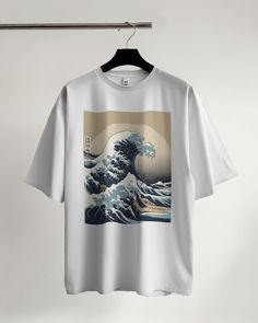 Celebrate the timeless beauty of Japanese art with our Japanese Hokusai Wave T-Shirt! Featuring the iconic Great Wave off Kanagawa by Hokusai, this tee is perfect for art enthusiasts, lovers of Japanese culture, and anyone who appreciates unique and captivating designs. Ideal for casual wear, special occasions, or as a thoughtful gift. The unisex soft-style t-shirt puts a new spin on casual comfort. Made from very soft materials, this tee is 100% cotton for solid colors. Heather colors and sport Artistic Crew Neck T-shirt With Printing, Artistic White T-shirt With Graphic Print, Artistic Printed Streetwear T-shirt, Artistic Printed T-shirt For Streetwear, White Tops With Graphic Print For Artistic Expression, White Graphic Print Art For Streetwear, Artistic White Shirt With Screen Print, Artistic Graphic Crew Neck Shirt, Artistic Printed White Shirt