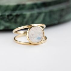 Moonstone 14K double gold ring. A gorgeous rainbow moonstone natural gemstone ring, ideal for women who love colors. Its minimalist design makes it the perfect choice for a promise ring, a Valentines Day Gift or a birthday gift. 100% handcrafted with love! D E T A I L S ● Metal: 14K solid gold or 14K white gold or 14K rose gold ● Gemstone: Moonstone, briolette cut ● Stone Diameter: 10mm (0.4in) R I N G ∙ S I Z I N G For General Reference: ● we use standard US Ring Sizing ● an average women's rin Celestial Moonstone Ring In 14k Gold As Gift, Moonstone Rings With Si Clarity For Anniversary, Moonstone Ring With Si Clarity For Anniversary, Celestial 14k Gold Moonstone Ring For Gift, Celestial 14k Gold Moonstone Ring As Gift, Celestial Style 14k Gold Moonstone Ring As Gift, Si Clarity Moonstone Rings For Anniversary, Delicate 14k Gold Moonstone Ring, Modern 14k Yellow Gold Moonstone Ring