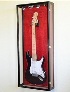 an electric guitar in a case on display