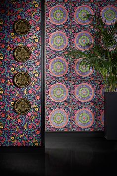 an artisticly designed room divider with colorful circles on it