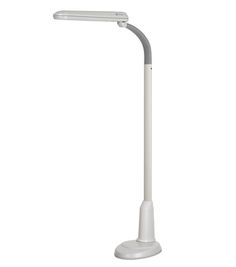 a white desk lamp sitting on top of a table