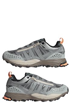 A protective shield ensures your laces stay secure in a sneaker built on a durable lugged sole and enhanced with reflective trims for better visibility. Textile and synthetic upper/textile lining/synthetic sole
 Imported Low-top Running Shoes With Reflective Details For Outdoor, Outdoor Mesh Running Shoes With Reflective Details, Sporty Outdoor Sneakers With Reflective Details, Dynamic Trail Running Shoes With Reflective Details, Dynamic Sneakers With Reflective Details For Outdoor Activities, Impact Resistant Synthetic Sneakers For Outdoor Activities, Gray Sneakers With Reflective Details For Outdoor, Dynamic Outdoor Sneakers With Reflective Details, Outdoor Lace-up Running Shoes With Reflective Details