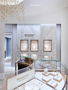 a jewelry store with marble walls and glass displays