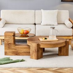 a wooden coffee table sitting on top of a white rug