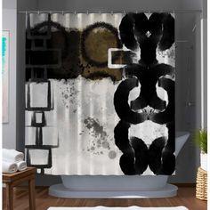 a shower curtain with black and white designs on it in a bathroom next to a bathtub