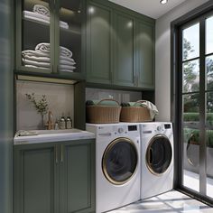 a washer and dryer in a room with green cabinets