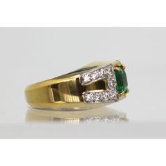 This is part of Chairish’s Fine Jewelry assortment.  This gorgeous David Webb Emerald and Diamond ring comes out of Paris and it is stunning. The ring features a gorgeous true Emerald Green Emerald square cut stone of approximately 1.25 to 1.50 carats and 18 Diamonds totaling approximately 0.90 carats. Metal: 18K Yellow Gold Weight: 13.8 Grams Stone: Square cut Emerald 1.25-1.50 Carats Stones:18 Diamonds .90 carats Size: 5-6 w/inner guard Dimensions: size 5-6.  This ring is double stamped Webb, Luxury Emerald Cut Gemstones For Anniversary, Classic Emerald Diamond Ring With Accent Stones, Diamond Baguette Cut Gemstone Rings, Fine Jewelry Asscher Cut Cubic Zirconia Emerald Ring, Fine Jewelry Cubic Zirconia Emerald Ring Asscher Cut, Diamond Ring With Accent Stones, Asscher Cut, Heirloom Diamond Rings With Square Cut, Square Cut Emerald Ring With Diamond For Promise, Exquisite Baguette Cut Diamond Accent Rings