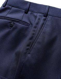 When selecting a separate trouser, you want something that can wear many hats and be a workhorse in your wardrobe. This Super 130s wool cloth is a classic, understated twill weave in a sturdier construction, giving it an understated look, solid drape and high level of durability suitable for frequent wear. Consider this a go-to, do-anything staple in your wardrobe that you can dress up or down as the occasion demands. FABRIC AND TRIMS: Woven in Italy by Drago, this Super 130s wool twill is made from a slightly thicker yarn, and woven with a dense construction, to give it a sturdy, substantial drape, while still preserving a soft, luxurious feel. 100% wool - Super 130s yarn count 310 grams/meter SEASONALITY: A medium-heavy weight suitable for any time of year, but perhaps not the very hotte Navy Fitted Dress Pants For Work, Elegant Navy Dress Pants For Work, Elegant Fitted Navy Dress Pants, Tailored Elegant Navy Pants, Classic Navy Dress Pants For Business Casual, Elegant Tailored Navy Pants, Tailored Navy Dress Pants With Welt Pockets, Navy Tailored Dress Pants With Welt Pockets, Classic Navy Dress Pants For Work