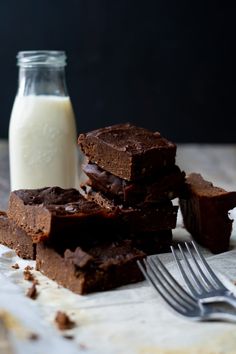 chocolate brownies and milk on a table