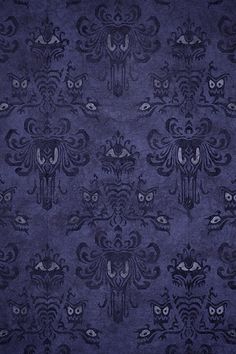 a blue and black wallpaper with an ornate design on the front, in shades of purple