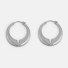 The Lune is a contemporary hoop earring with rounded edges and a deep notch at the center of the design. The domed effect tapers towards the ends, finishing with a minimal pin closure. Materials: Stainless Steel Modern Metal Huggie Earrings For Everyday, Modern Metal Pierced Huggie Earrings, Modern Nickel-free Open Circle Hoop Earrings, Minimalist Teardrop Hoop Earrings With Polished Finish, Minimalist Metal Hoop Earrings With Polished Finish, Modern Open Circle Pierced Hoop Earrings, Modern Metal Open Circle Hoop Earrings, Modern Hoop Earrings With Shiny Finish, Modern Small Hoop Pierced Earrings