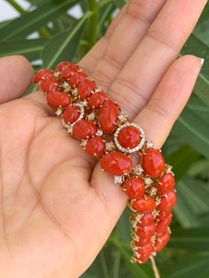 18k Gold Coral Diamond Bracelet, Italian Coral Bracelet Cuff, Red Coral Diamond Bangle, Coral Diamond Jewelry, Big Coral Cuff, Bold Coral Cuff Gorgeous bracelet in 18kt yellow gold with fine red Italian coral rhombuses and, between of them, white diamonds of various sizes. Studded with diamonds with a beautiful shade of Red Coral which shines to a luminous Red-Orange in the Sun it is a collector's piece! Diamonds 2.67 ct, Red Italian Corals 58.69 carats Length 6.5 inches Total Weight 41.9 gms A Luxury Red Diamond Bracelet For Weddings, Luxury Red Diamond Bracelet For Formal Occasions, Luxury Red Diamond Wedding Bracelet, Luxury Red Diamond Jubilee Bracelet, Red Diamond Bracelets Fine Jewelry, Red Diamond Fine Jewelry Bracelet, Luxury Red Diamond Bracelet For Anniversary, Luxury Round Coral Jewelry, Designer Red Bracelet Jewelry