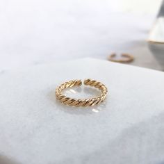 A delicate chain link ring that gives off a delicate touch when worn on its own and looks even better when stacked and mixed together with an assortment of bold and delicate rings.Materials: 14K Gold Plated Brass Silver Plated Brass Hypoallergenic and Nickel FreeSize: US 6This item comes with a one-year warranty.Greeting card and/or gift receipt for exchange is available with purchase at checkout. Dainty Tarnish Resistant Open Band Midi Rings, Dainty Tarnish-resistant Open Band Midi Rings, Dainty Open Band Midi Rings, Dainty 14k Gold Chain Ring With Metal Detail, Adjustable Minimalist Open Chain Ring, Dainty Gold Stackable Chain Ring, Everyday Gold Rings With Delicate Chain, Dainty Open Ring With Adjustable Chain, Minimalist Gold Ring With Delicate Chain