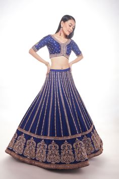 Blue silk lehenga with intricate motifs at the base and delicate lines of zardozi paired with matching blouse and net dupatta with thick main border and thinner borders on 3 sidesFrom Chamee and Palak 's The Wedding Edit collectionDELIVERY TIMEPlease allow 8-12 weeks for your outfit to arrive.FABRIC DETAILSSilk And NetProfessional cleaning only. Blue Silk Lehenga For Reception, Blue Semi-stitched Silk Choli, Elegant Royal Blue Lehenga For Reception, Festive Royal Blue Elegant Choli, Designer Lehenga With Dori Work In Silk Thread, Blue Intricate Embroidered Anarkali Set For Wedding, Blue Silk Lehenga For Navratri, Bollywood Silk Thread Lehenga With Dori Work, Elegant Cutdana Silk Thread Choli