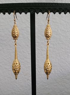 Adorn yourself with these stunning beautiful Golden Brass earrings with intricate details , these are the same on both sides . These earrings are 3-1/4 " inches long. * 18k gold over stainless earwires. These earrings are not heavy and the brass is very well made and sturdy with 24k gold matte plating.  *Jewelry is free of lead, free of nickel and eco-friendly.  *All materials sourced in The United States, Italy, The United Kingdom, Austria, Spain and Portugal.   *All my jewelry is made and desi Ornate Bronze Filigree Earrings, Traditional Bronze Filigree Earrings, Brass Filigree Dangle Plug Earrings, Elegant Gold Plug Earrings For Festivals, Antique Gold Filigree Dangle Earrings, Ornate Filigree Plug Earrings, Antique Gold Drop Earrings With Intricate Design, Brass Filigree Drop Plug Earrings, Ornate Brass Danglers