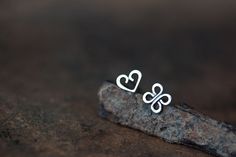 This is a mismatched pair of tiny stud earrings - you are getting one tiny heart and one four leaf clover (Celtic knot) shape. Studs are hand fabricated by me from solid sterling silver. I believe these popular symbols in a pair will make a great gift for someone special :) ● Earrings will be shipped with sterling silver backs ● Heart shape measures approx 6 x 7.5 mm ● Clover (Celtic knot) measures approx 7 x 7 mm If you prefer *matched* earrings: ► Pair of heart studs: http://www.etsy.com/listi Delicate Sterling Silver Heart Earrings Gift, Personalized Sterling Silver Heart Earrings As Gift, Dainty Sterling Silver Heart Earrings As Gift, Handmade Dainty Sterling Silver Heart Earrings, Clover Symbol, Mens Diamond Stud Earrings, Blue Diamond Wedding Ring, One Four, Small Silver Earrings