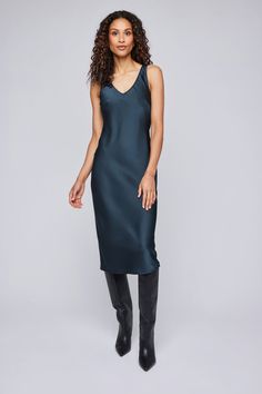 This silky midi dress in black and twilight is perfect for any occasion. Easy to dress up and down, you can easily transition from day to night with this versatile and chic piece. Feminine V-neck Slip Dress For Bedtime, Black V-neck Slip Dress For Daywear, Black Midi V-neck Dress For Daywear, Black V-neck Slip Dress For Sleep, Black V-neck Slip Dress With Lace Trim, Pullover Cardigan, Long Midi Dress, Satin Midi Dress, Sleeveless Sweater