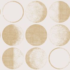 a beige and white wallpaper with circles on it