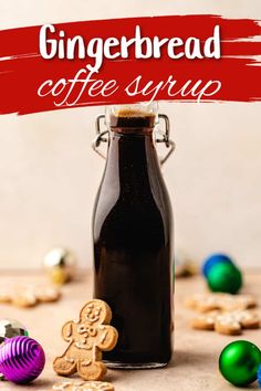 gingerbread coffee syrup in a glass bottle surrounded by cookies and christmas ornaments with the words gingerbread coffee syrup