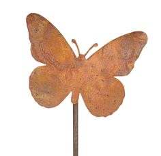 a rusted metal butterfly on a white background