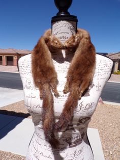 54" real 2 pelt MINK FUR scarf scarves collar boa stole, full pelt mink scarf, medium brown mink FUR, vintage fur scarf, unusual (#1765) Vintage MINK FUR stole scarf wrap collar boa stoll ... TWO full MINK pelts which are permanently joined at the noses.  Includes heads, rear legs/feet and tails.  A medium shade of brown.  My best guess is that this is from the 1980's.  You wrap it around your shoulders as you choose.  There are NO CLOSURES on this full pelt mink scarf wrap.  The scarf collar boa stole stoll measures 54" long and the body is 3.5" wide.  Please see pictures.  No smells or undisclosed damage.  This is in good vintage condition.  A classic, timeless piece for your wardrobe!  A wonderful conversation piece, as well. stock number 1765 Pictures should answer your questions, but Stole Scarf, Fur Stole, Fur Scarf, Vintage Fur, Mink Fur, Medium Brown, Conversation Piece, Timeless Pieces, Scarf Wrap