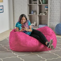 Includes: One (1) beanbag chair Material: Polyester fabric Fill material: Foam Color options: Kiwi green, fuchsia pink, red, or purple Closure: Double zipper Care instructions: Cold wash, removable cover Weight: 20-pounds Dimensions: 26 inches high x 46 inches wide x 34 inches wide Hot Pink Bean Bag, Giant Pink Bean Bag, Pink Beanbag Couch, Tv Game Room, Alternative Seating, Bean Bag Lounger, Bean Bag Covers, Cozy Pillow, Online Furniture Shopping