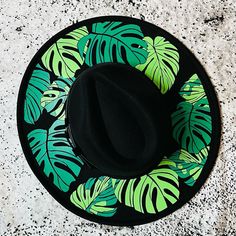 "Welcome to Witchwood's brand new XL wide brim hats! These hats have our biggest brim yet! They are made of sturdy vegan felt and are all hand printed.   Vegan Felt Size: 23\" (but size is adjustable and can be sized down, inside the hat) Brim - 3.75\" wide Hat Color - Black Print Color - Green & Light Green" Cheap Fun Hats With Flat Brim, Cheap Fun Hat With Flat Brim, Cheap Graphic Print Curved Brim Hats, Green Flat Brim Fedora For Beach, Green Flat Brim Hat For Vacation, Green Wide Brim Fedora For Vacation, Green Fedora With Curved Brim For Vacation, Green Curved Brim Fedora For Vacation, Green Curved Brim Straw Hat For Festivals