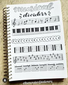 an open notebook with music notes on it and the words musical dividers written in cursive writing