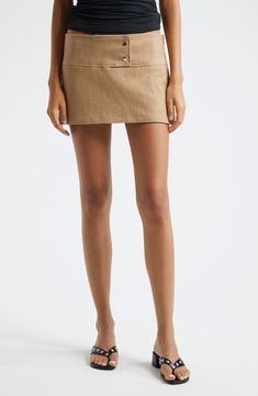 The Spanish designer draws inspiration from the low-slung silhouettes of Y2K for this twill micromini skort designed with an ultrawide waistband. Front snap closure 63% recycled cotton, 27% recycled polyester, 8% viscose, 2% elastane Hand wash, line dry Made in Spain Designer Clothing Modern Mini Bottoms For Summer, Summer Workwear Mini Hem Skort, Summer Workwear Mini Skort, Modern Mini Length Bottoms For Summer, Modern Mini-length Summer Bottoms, Modern Short Mini Skirt For Spring, Spring Modern Mini Skort, Modern Summer Skort, Modern Mini Skort For Summer