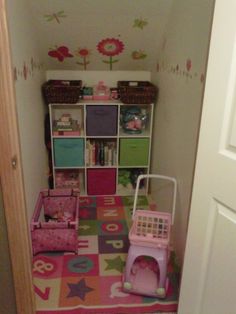 a small child's room with toys and bookshelves