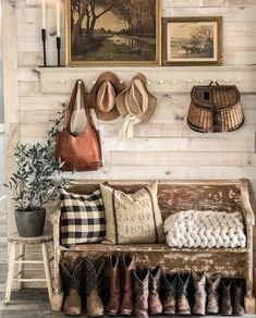 a wooden bench sitting next to a wall filled with hats