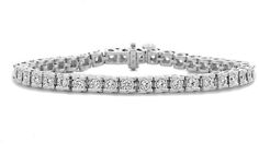 Zales 3/4 CT. T.W. Diamond Tennis Bracelet in 14K White Gold (I/I2) White Gold Channel Set Diamond Bracelet, Timeless Diamond Bracelet With Channel Set For Formal Occasions, Timeless Channel Set Diamond Bracelet For Formal Occasions, Timeless Channel Set Diamond Bracelet For Formal Events, Luxury Diamond Tennis Bracelet With Channel Set, Luxury Diamond Channel Set Tennis Bracelet, White Gold Channel Set Tennis Bracelet For Anniversary, Modern White Gold Diamond Bracelet Channel Set, Modern Channel Set Diamond Bracelet In White Gold