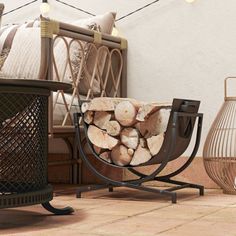 a pile of wood sitting on top of a wooden floor next to a basket filled with logs