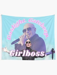 a man holding a microphone in front of a blue background with the words girlboss on it