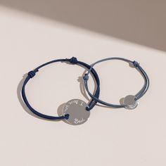 Treasure special moments together with our Personalized Father and Child Bracelet Set. Hand-engrave precious names and dates onto our delicate mini and large pastille charms. 925 Sterling SilverLarge pastille charm: 0.8x0.8Mini Pastille Charm: 0.4 x 0.4Father bracelet Size: 8-9Choose from a wide range of braid colours in durable, colourfast polyesterFully adjustable sliding knot fasteningHand-engraved in our Paris workshopSent with love in a complimentary gift boxAny slight variations in letteri Braid Colours, Son Bracelet, Braids For Kids, Engraved Bracelet, Father Son, Sliding Knot, White Turquoise, Special Moments, Father And Son