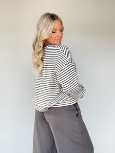 Feel elevated and sophisticated in our Another Coffee Striped Top, a stylish take on a classic design. This timeless striped top features a rounded neckline and a relaxed fit for maximum comfort. Soft and stretchy, it's perfect for lounging or a brunch date. Enjoy versatile style for any occasion, from work to school to errands. Sophisticated, cozy, and chic – you can't go wrong! 58% Cotton 34% Polyester 8% Spandex Hand wash cold. Spring Oversized Top With Striped Hem, Oversized Spring Top With Striped Hem, Oversized Striped Hem Tops For Spring, Chic Oversized Top With Striped Collar, Oversized Tops With Striped Hem For Spring, Oversized Top With Striped Hem, Chic Oversized Striped Top, Chic Tops With Striped Sleeves For Day Out, Relaxed Striped Tops For Spring