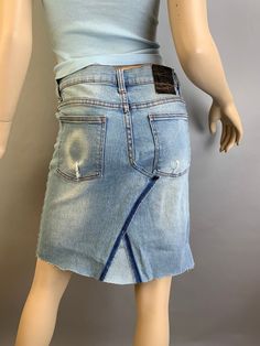 Vintage up-cycled light blue denim jeans skirt made from Cheap Monday Jeans in excellent condition size 26. Low waist 30 Hip 31 Waist to hem 19 inches Medium Wash Cotton Cutoff Skirt, Light Wash Cotton Cutoff Skirt, Fitted Cutoff Denim Skirt, Distressed Cotton Denim Skirt, Distressed Denim Blue Cotton Skirt, Fitted Cutoff Medium Wash Denim Skirt, Light Wash Cotton Denim Skirt With Frayed Hem, Light Wash Fitted Cotton Denim Skirt, Fitted Cutoff Denim Skirt In Medium Wash