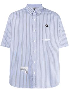 blue cotton vertical stripe pattern logo patch at the chest logo print embellishment button-down collar front button fastening short sleeves curved hem Cotton Shirt With Contrast Stripes And Short Sleeves, Striped Cotton Short Sleeve Shirt, Blue Cotton Shirt With Signature Stripes, Striped Short Sleeve Shirt With Button Closure, Pinstripe Cotton Short Sleeve Shirt, Blue Short Sleeve Button-up Shirt With Placket, Blue Striped Short Sleeve T-shirt, Blue Short Sleeve T-shirt With Contrast Stripes, Cotton Button-up Top With Contrast Stripes