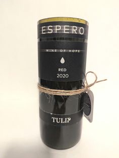 a wine bottle wrapped in twine and tied to a string with the label espero winery of hope