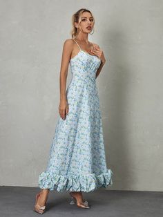 The Ilsa Spaghetti Floral Maxi Dress in Blue is a breathtaking display of beauty and charm. With its delicate spaghetti straps and vibrant floral pattern, it exudes a sense of feminine grace and elegance. The flowing maxi length adds an ethereal touch, making it an ideal choice for special occasions or summer soirées where effortless glamour is desired. Material: 100% Polyester Invisible zipper opening at the back Stretch Factor: Non Stretch Clean: Gentle machine wash Color may vary due to the l Blue Sundress With Adjustable Straps For Spring, Spring Vacation Maxi Dress With Sweetheart Neckline, Spring Maxi Dress With Ruffles And Spaghetti Straps, Sundress Maxi Dress With Sweetheart Neckline And Adjustable Straps, Blue Maxi Dress With Sweetheart Neckline For Garden Party, Blue Maxi Dress With Sweetheart Neckline For Summer, Blue Spaghetti Strap Dress For Garden Party, Light Blue Spring Dress With Adjustable Straps, Summer Floral Print Light Blue Maxi Dress