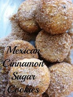 a pile of sugared donuts sitting on top of a plastic container filled with powdered sugar